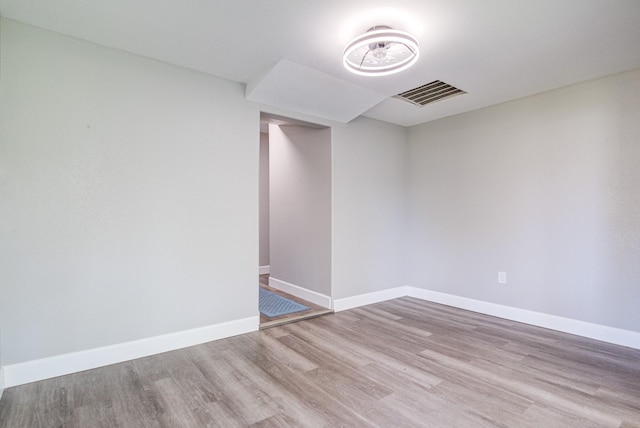 1111 Robinson St, Alvin, TX 77511 - empty room with wood finished floors and baseboards
