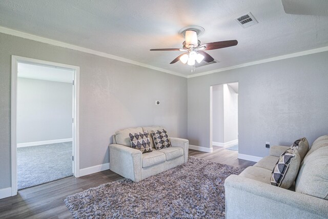 1111 Robinson St, Alvin, TX 77511 - living room with wood finished floors, a ceiling fan, and crown molding