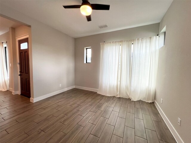 18518 Parkland Xing, Cypress, TX 77433 - unfurnished room featuring a ceiling fan and dark wood-style flooring