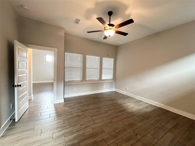 18518 Parkland Xing, Cypress, TX 77433 - unfurnished room with a ceiling fan and dark wood-style flooring