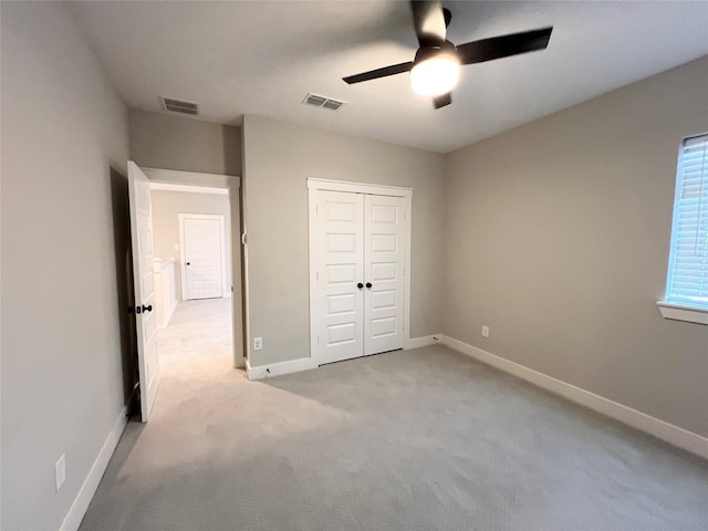 18518 Parkland Xing, Cypress, TX 77433 - unfurnished bedroom with carpet floors, a closet, and a ceiling fan