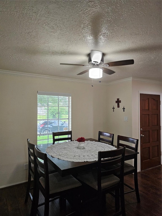 19423 Quiet Brook Dr, Houston, TX 77084 - dining space with dark wood-style flooring, crown molding, a ceiling fan, and a textured ceiling