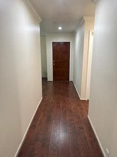 19423 Quiet Brook Dr, Houston, TX 77084 - hall featuring wood finished floors and crown molding