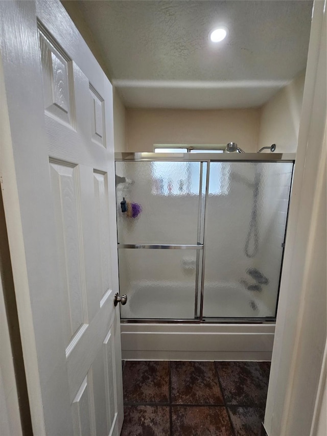 19423 Quiet Brook Dr, Houston, TX 77084 - bathroom featuring enclosed tub / shower combo, recessed lighting, tile patterned flooring, and a textured ceiling