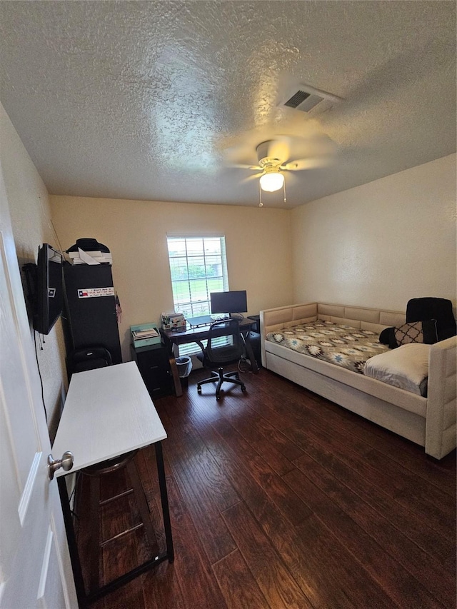 19423 Quiet Brook Dr, Houston, TX 77084 - office featuring a textured ceiling, dark wood-style flooring, and ceiling fan