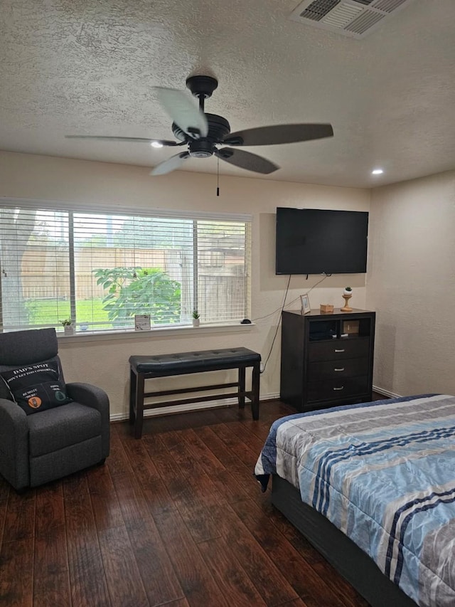 19423 Quiet Brook Dr, Houston, TX 77084 - bedroom with hardwood / wood-style floors, a ceiling fan, and a textured ceiling