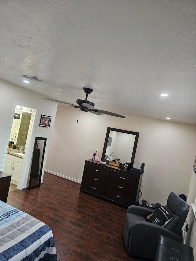 19423 Quiet Brook Dr, Houston, TX 77084 - bedroom featuring a textured ceiling, wood finished floors, recessed lighting, a ceiling fan, and ensuite bath