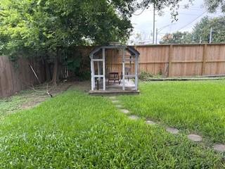 19423 Quiet Brook Dr, Houston, TX 77084 - view of outdoor structure with a fenced backyard