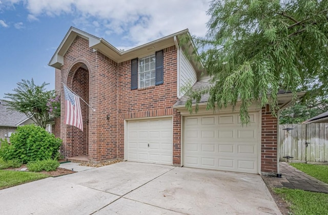 14334 Cypress Valley Dr, Cypress, TX 77429 - traditional-style home with concrete driveway, brick siding, and an attached garage