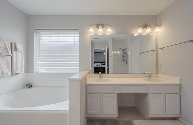14334 Cypress Valley Dr, Cypress, TX 77429 - bathroom featuring a garden tub, double vanity, and a stall shower