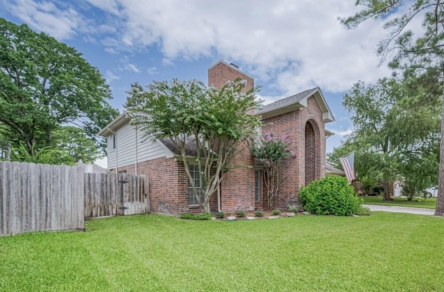 14334 Cypress Valley Dr, Cypress, TX 77429 - view of home's exterior featuring brick siding and a chimney