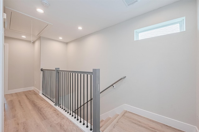 807 Ave J Pl, Conroe, TX 77301 - staircase with attic access, wood finished floors, and recessed lighting