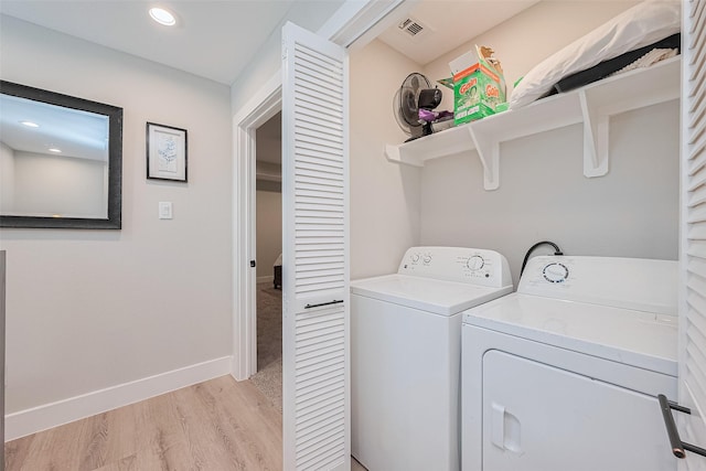 807 Ave J Pl, Conroe, TX 77301 - laundry room featuring washing machine and clothes dryer, light wood-type flooring, and recessed lighting