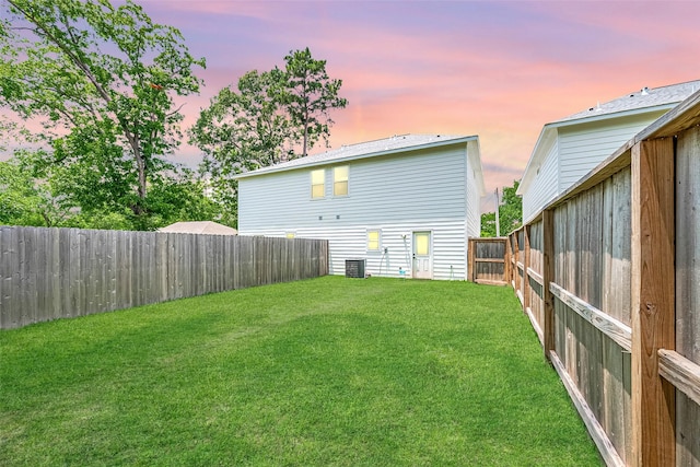 807 Ave J Pl, Conroe, TX 77301 - back of property at dusk with a fenced backyard