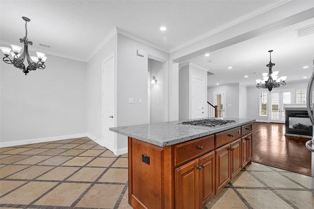 194 W Breezy Way, The Woodlands, TX 77380 - kitchen with inlaid floor details, a chandelier, recessed lighting, ornamental molding, and light stone counters