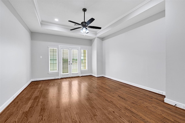 194 W Breezy Way, The Woodlands, TX 77380 - unfurnished room featuring a raised ceiling, wood finished floors, ceiling fan, ornamental molding, and recessed lighting