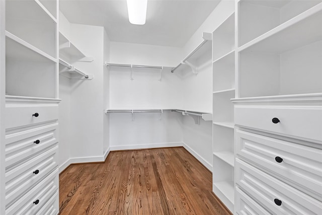 194 W Breezy Way, The Woodlands, TX 77380 - spacious closet featuring dark wood-style floors