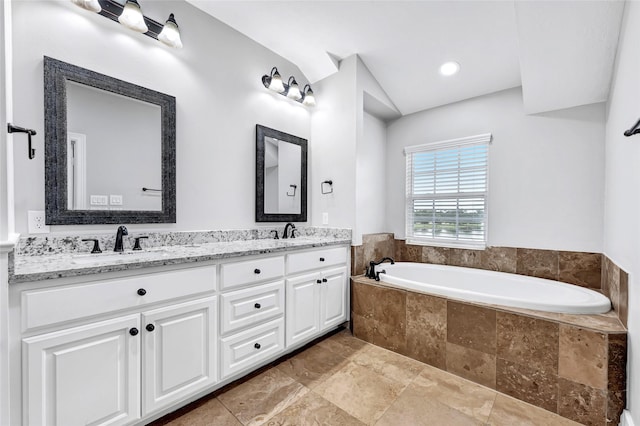 194 W Breezy Way, The Woodlands, TX 77380 - full bathroom featuring double vanity, a garden tub, and stone finish flooring