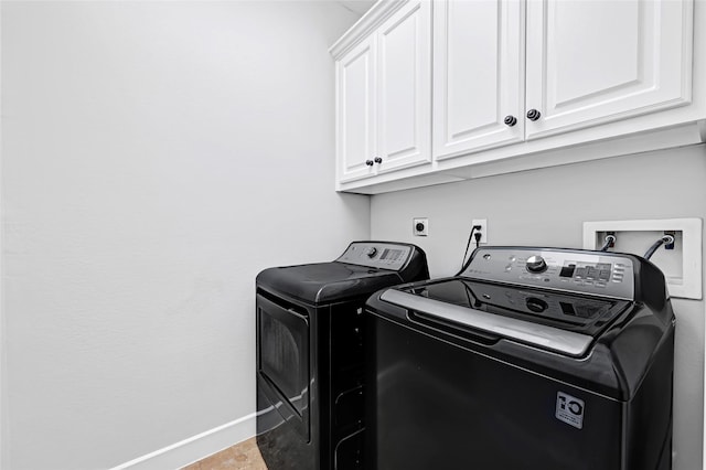 194 W Breezy Way, The Woodlands, TX 77380 - laundry area featuring cabinet space and washing machine and clothes dryer