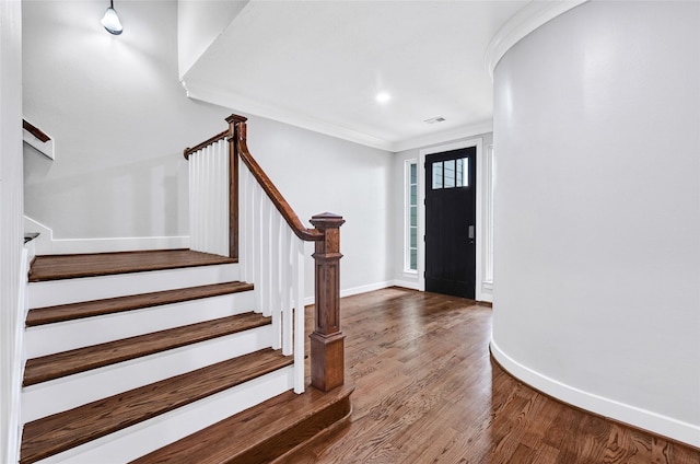 194 W Breezy Way, The Woodlands, TX 77380 - foyer entrance featuring wood finished floors, stairway, and ornamental molding