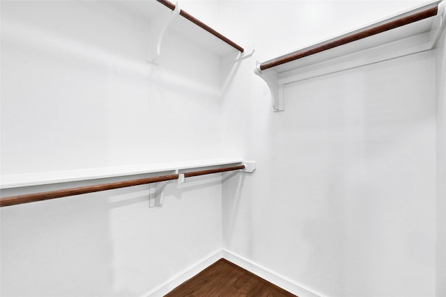 194 W Breezy Way, The Woodlands, TX 77380 - spacious closet featuring dark wood finished floors