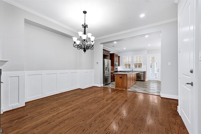 194 W Breezy Way, The Woodlands, TX 77380 - kitchen featuring a chandelier, light countertops, ornamental molding, a center island, and dark wood-style flooring