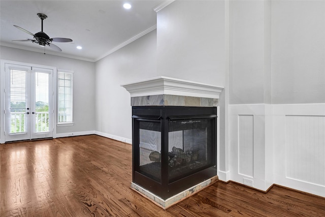 194 W Breezy Way, The Woodlands, TX 77380 - unfurnished living room featuring ornamental molding, wood finished floors, a ceiling fan, a multi sided fireplace, and french doors