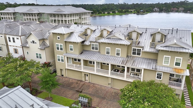 194 W Breezy Way, The Woodlands, TX 77380 - view of building exterior featuring a water view and a garage