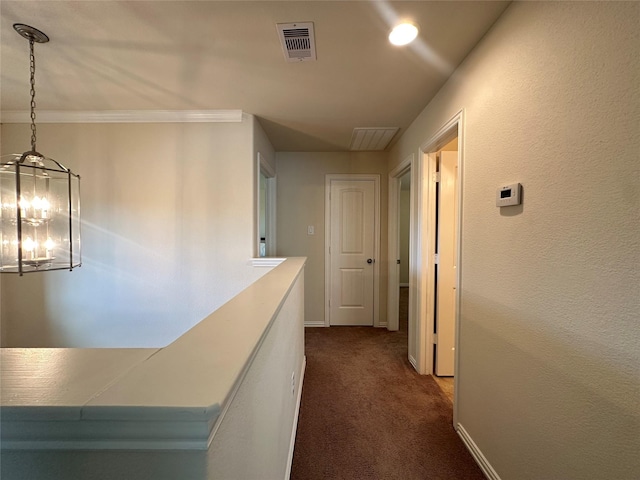 6818 Pear Point Ln, Richmond, TX 77469 - hallway featuring dark colored carpet and a chandelier