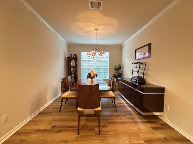 6818 Pear Point Ln, Richmond, TX 77469 - dining space with a chandelier, wood finished floors, and ornamental molding