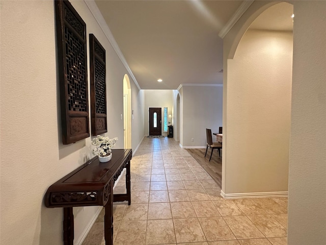 6818 Pear Point Ln, Richmond, TX 77469 - hallway with arched walkways, ornamental molding, light tile patterned floors, and recessed lighting