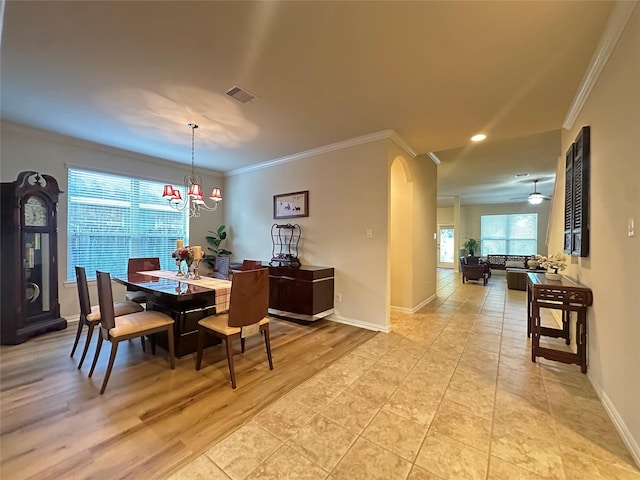 6818 Pear Point Ln, Richmond, TX 77469 - dining room with crown molding, arched walkways, recessed lighting, a chandelier, and ceiling fan