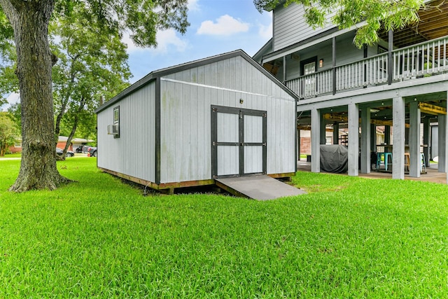 7806 Burgess Rd, Hitchcock, TX 77563 - rear view of house featuring a yard, a shed, and a balcony