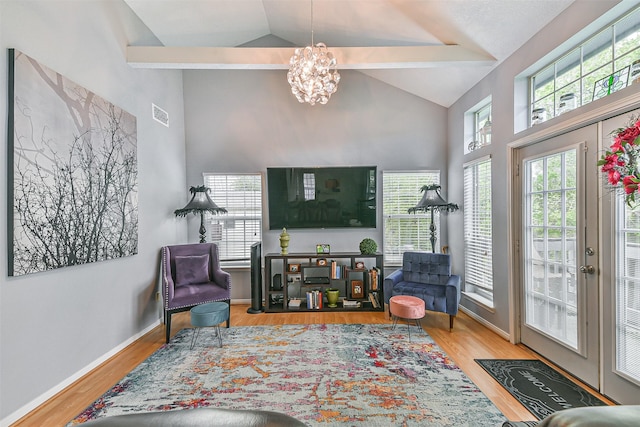 7806 Burgess Rd, Hitchcock, TX 77563 - living area with a chandelier, high vaulted ceiling, and wood finished floors