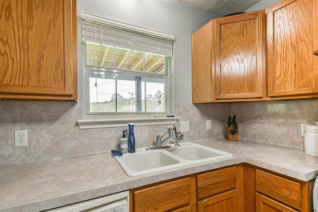 7806 Burgess Rd, Hitchcock, TX 77563 - kitchen featuring light countertops, backsplash, and brown cabinets