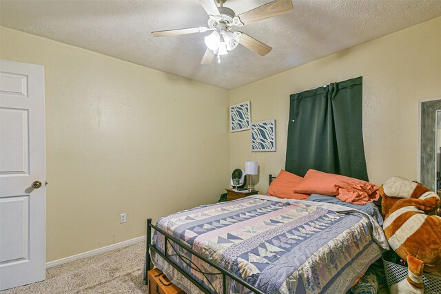 7806 Burgess Rd, Hitchcock, TX 77563 - carpeted bedroom featuring a ceiling fan and a textured ceiling