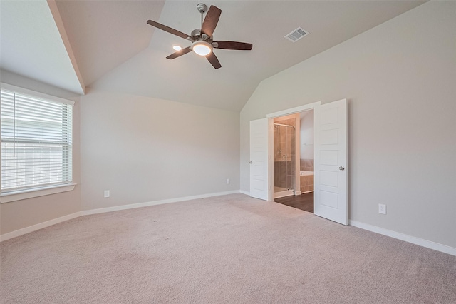 21830 Hickory Springs Ct, New Caney, TX 77357 - unfurnished bedroom with vaulted ceiling, carpet, ensuite bath, and ceiling fan