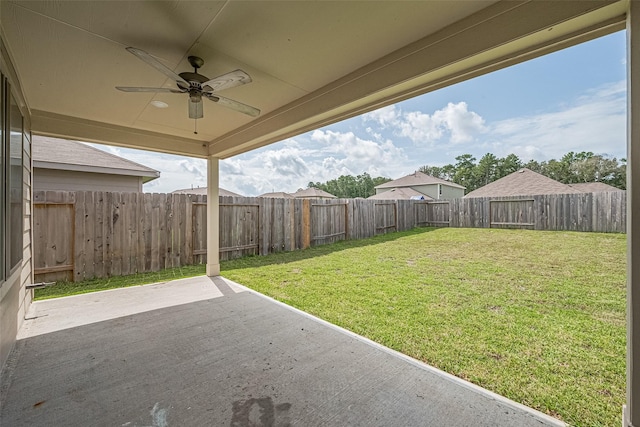 21830 Hickory Springs Ct, New Caney, TX 77357 - fenced backyard featuring a patio area and ceiling fan