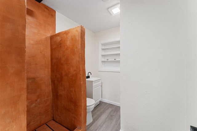 4715 Engleford St, Houston, TX 77026 - bathroom with wood finished floors and toilet