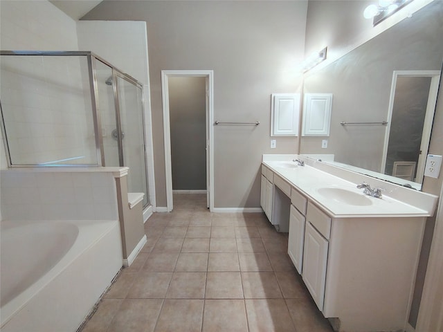 3511 Glenhill Dr, Pearland, TX 77584 - full bath featuring a stall shower, double vanity, a bath, tile patterned flooring, and vaulted ceiling