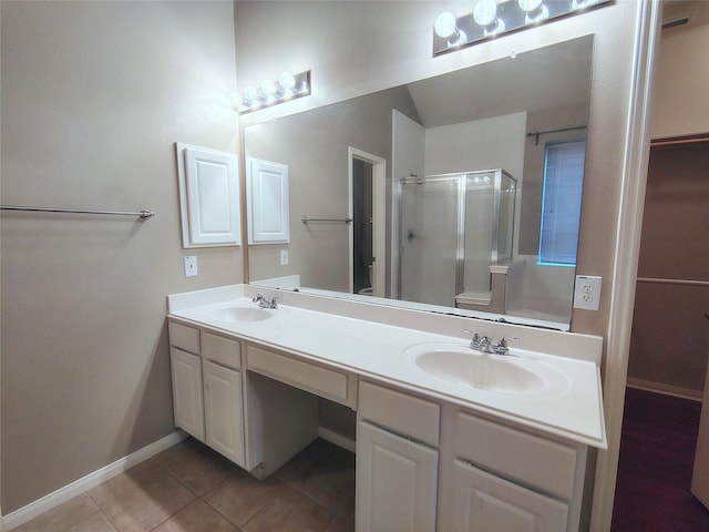 3511 Glenhill Dr, Pearland, TX 77584 - bathroom featuring a shower stall, double vanity, and tile patterned floors