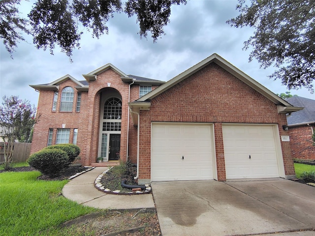 3511 Glenhill Dr, Pearland, TX 77584 - view of front of home featuring an attached garage, brick siding, and driveway