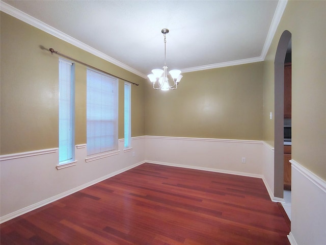 3511 Glenhill Dr, Pearland, TX 77584 - spare room featuring arched walkways, wood finished floors, ornamental molding, and a chandelier
