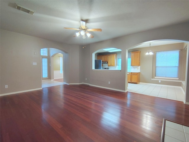 3511 Glenhill Dr, Pearland, TX 77584 - unfurnished living room featuring wood finished floors, a ceiling fan, and plenty of natural light