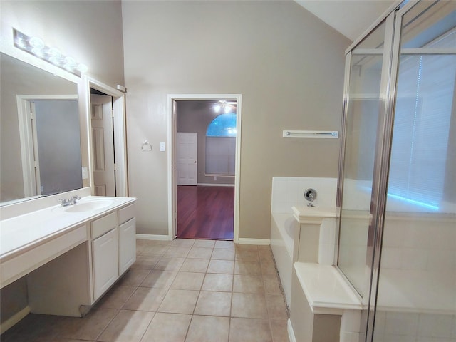3511 Glenhill Dr, Pearland, TX 77584 - bathroom with a bath, vanity, tile patterned floors, high vaulted ceiling, and a shower with door