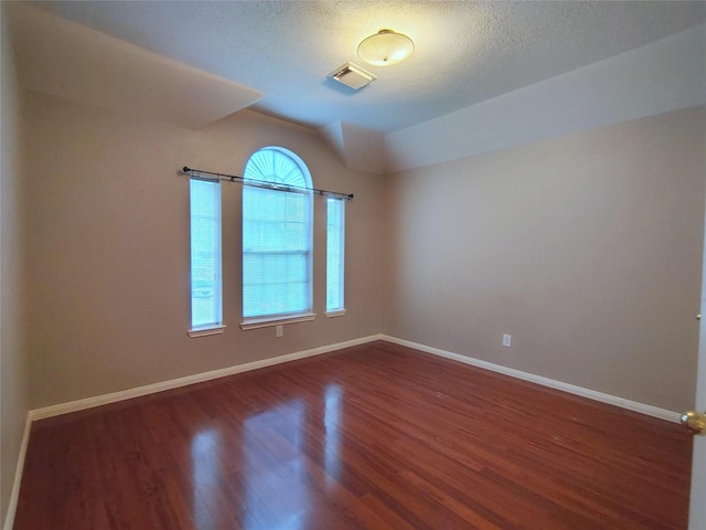 3511 Glenhill Dr, Pearland, TX 77584 - spare room with wood finished floors and a textured ceiling