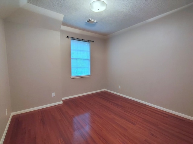 3511 Glenhill Dr, Pearland, TX 77584 - unfurnished room featuring wood finished floors and a textured ceiling
