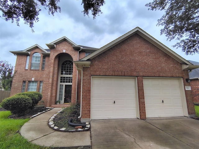3511 Glenhill Dr, Pearland, TX 77584 - view of front of home featuring an attached garage, concrete driveway, and brick siding