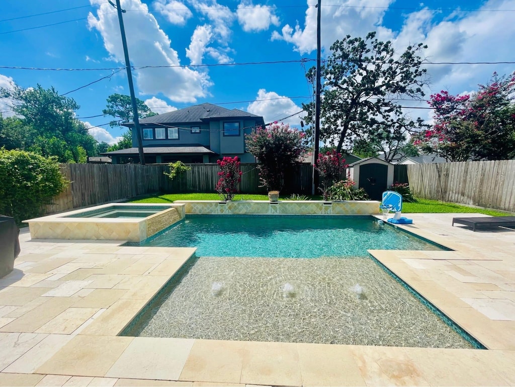 1511 Thornton Rd, Houston, TX 77018 - view of pool featuring a storage unit, a fenced backyard, a patio area, and a pool with connected hot tub