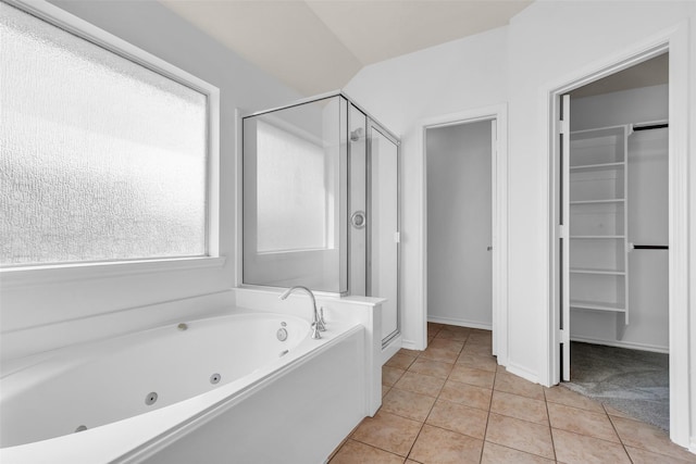 3502 Avalon Spring Ln, Spring, TX 77386 - bathroom featuring a shower stall, a tub with jets, tile patterned flooring, and a spacious closet
